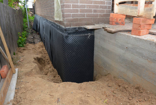 Happy homeowners after waterproofing job in Spring House